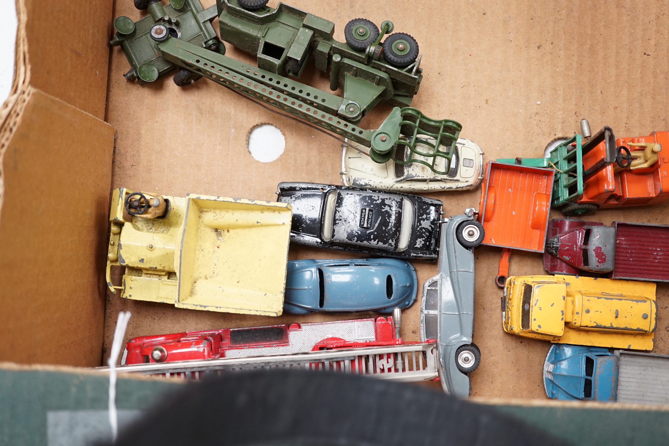 Twenty-two Dinky Toys mostly for restoration, including a Car Carrier (984), Missile Erector, Missile Servicing Platform, Spectrum Pursuit Vehicle, Thunderbird 2 containing Thunderbird 4, Rolls-Royce Silver Wraith, etc.